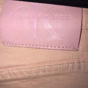 Pink Calvin Klein ripped mom jeans